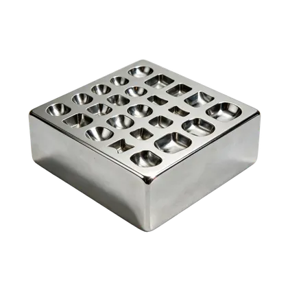 A polished chrome swage block, a heavy block with rows of shaped depressions